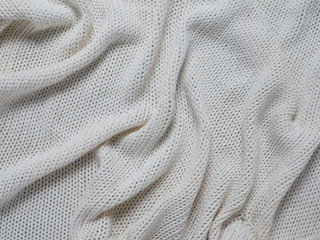 Cotton handmade knitted large blanket, trendy concept. Close-up of knitted blanket, knit background, white background.