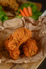 Crispy fried chicken on brown paper, Selective focus.