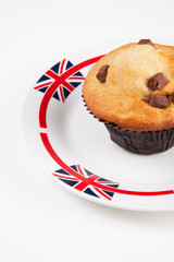 Close-up of cupcake on plate over white background