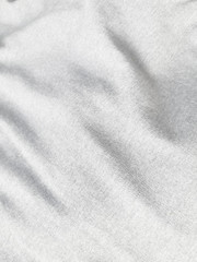 Fototapeta na wymiar Surface White cotton cloth background, shallow focus, blur