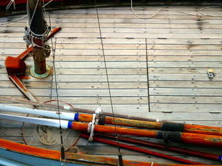 wooden sailboat dock with oars