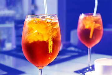 Refreshing Delicious Orange Alcoholic Cocktail With Ice In Glass Covered Drops Or Splashes Of Water.