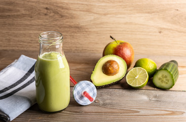 Homemade smoothie with the following detox ingredients avocado, cucumber, apple and lemon.