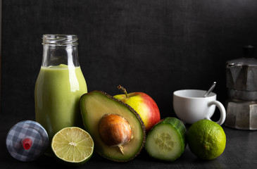 Homemade smoothie with the following detox ingredients avocado, cucumber, apple and lemon.