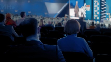 people at a conference or presentation, workshop, master class photograph. Back view