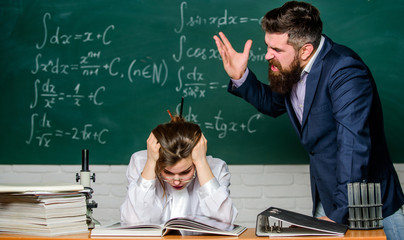 Teacher strict serious bearded man having conflict with student girl. Conflict situation. School...