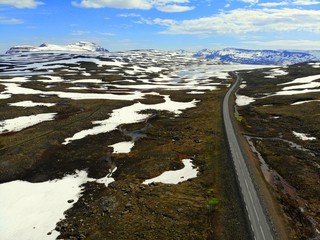 The aerial view of a partly snowy area on Route 92 towards Seydisfjordur, Iceland