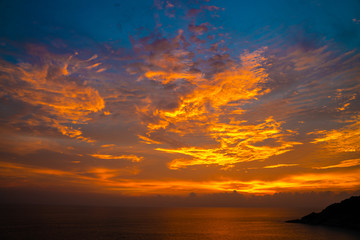 Colourful majestic sunset sky with cloud on sea shore wide angel len