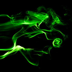 Fototapeta premium Green smoke on black background