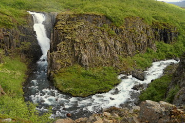 The view of Fardagafoss, a remotely located waterfalls near Seydisfjordur, Iceland in the summer