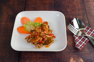 Spicy salad of sardine with tomato sauce mixed with herb