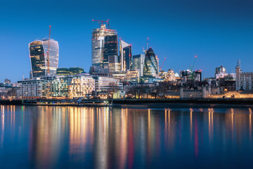 Obraz na płótnie Canvas London skyscraper skyline with reflection in Thames river during twilight in London, UK