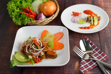 Spicy salad of sardine in tomato sauce mixed with herb