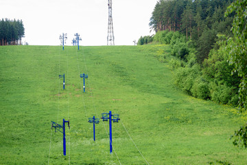 Lift with iron poles and cables for lifting people on the mountain.