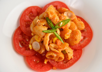 Stir fried macaroni with tomato sauce and pork
