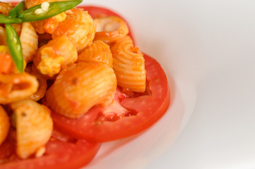 Stir fried macaroni with tomato sauce and pork