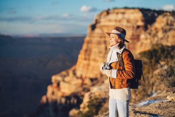 Young hiker with a retro camera in the Grand Canyon National Park