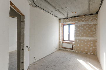 Russia, Moscow- September 10, 2019: interior room apartment rough repair for self-finishing. interior decoration, bare walls of the room, stage of construction