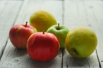 .apple background. On a white wooden table. In a rustic style. Books