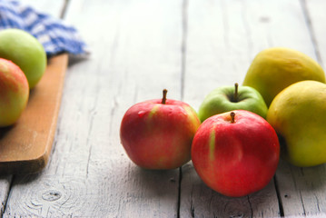 .apple background. On a white wooden table. In a rustic style. Books
