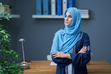 Muslim female student learning at home