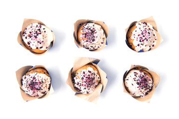 Blueberry muffins with white chocolate isolated on white background, food pattern, top view