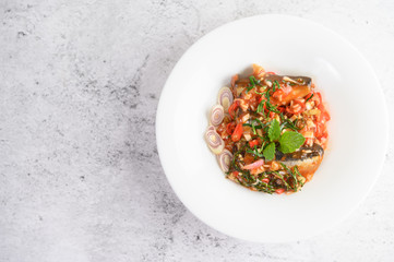 Appetizers with sardine in tomato sauce and spicy