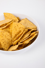 Close-up of nachos in bowl over white background
