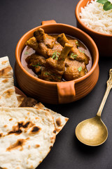 Hyderabadi Mutton Paya, Nehari, nazari or Nihari Masala. served with Naan and rice. selective focus