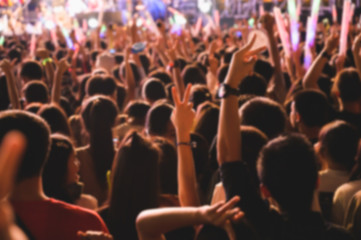 Abstract blurred background of Music concert any people. Crowd attending a concert.