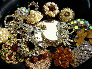 Vintage jewelry close-up. Old brooches with rhinestones.