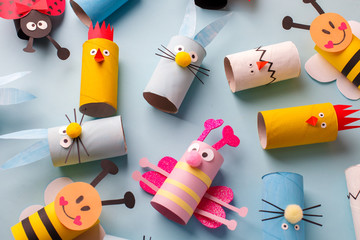 Happy easter kindergarten decoration concept - rabbit, chicken, egg, bee from toilet paper roll tube. Simple diy creative idea. Eco-friendly reuse recycle decor, daycare paper craft