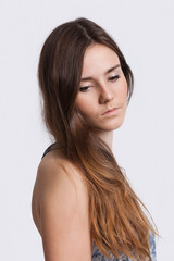 Thoughtful young woman over white background