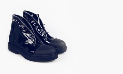 stylish black boots on white background