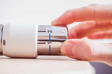 Heating costs: Heat regulator on a heater, close up picture.