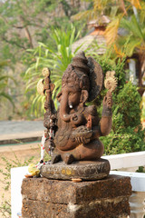 Sitting Ganesha statue in the Buddhist temple.