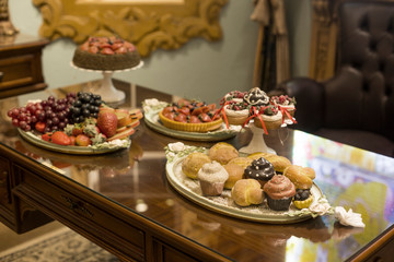 Fruit and bread on antique wooden table