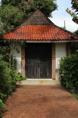 Old wooden pavilion door of the Thai temple.
