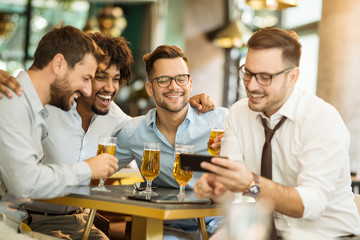 Fun after work with beer. Group businessman drink beer after work