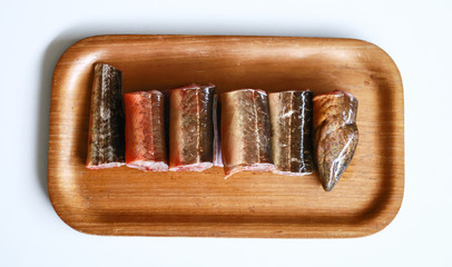 Pieces of eel ready to cook on white background.