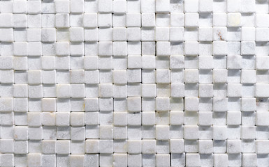 Mosaic tile from of natural white marble. Wall panel from white quartz.