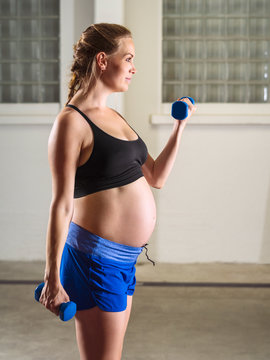 Beautiful Pregnant Woman Doing Bicep Curls