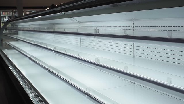 empty white shelves in a store, supermarket