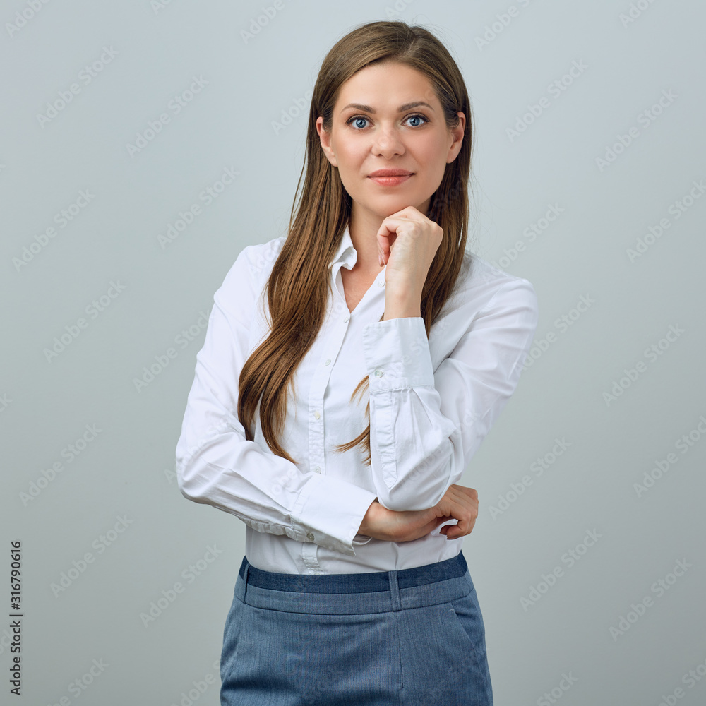 Wall mural woman in office dress code clothes touchin her chin