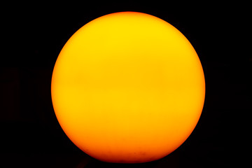 orange ball on black background