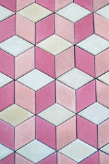colored paving slabs by mosaic, closeup. Road paving construction. Tessellated sidewalk tile