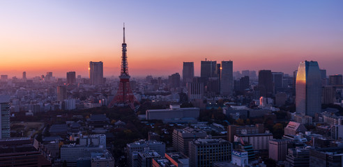 Tokyo tower and skyscrapers at sunset time
