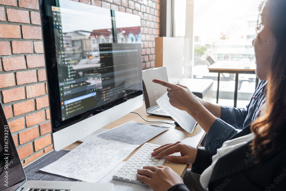 Aufkleber Programmers cooperating at Developing programming and website working in a software develop company office, writing codes and typing data code, Programming with HTML, PHP and javascript