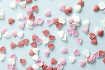 Decorative hearts on a blue background. Valentine's day decor concept. February 14