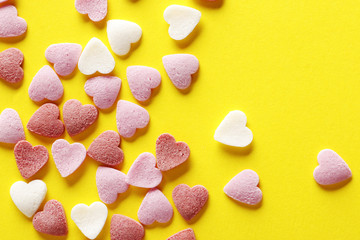 Decorative hearts on a yellow background. Valentine's day decor concept. February 14